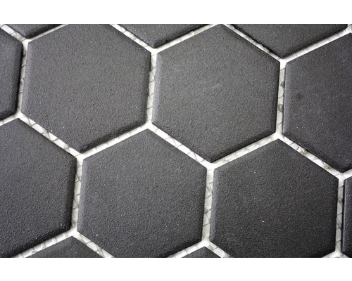 Gros plan de carreaux de sol hexagonaux foncés