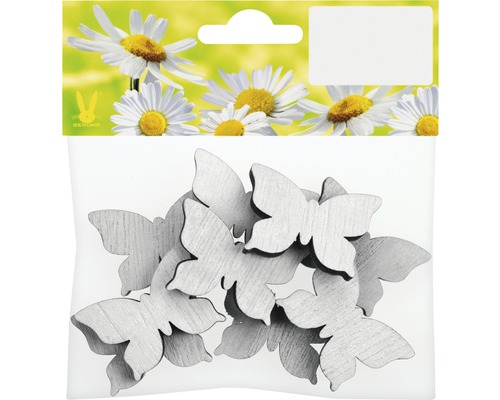 Papillons en bois pour la décoration dans un emballage