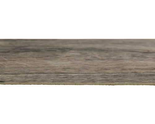 Gros plan d''un carreau de sol en vinyle avec aspect bois.