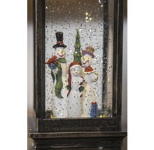 Lanterne boule à neige avec famille de bonhommes de neige et arbre