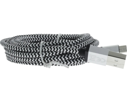 Câble USB-A vers Micro-USB enroulé avec gaine textile à motif chevron noir et blanc.
