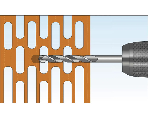 Une perceuse perce une plaque.