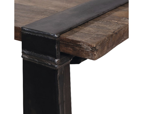 Vue détaillée d''un plateau de table en bois avec bordure métallique et pied de table