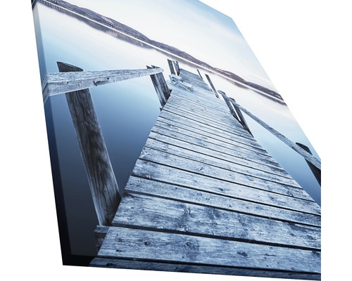 Leinwandbild mit einer Holzbrücke über einen See
