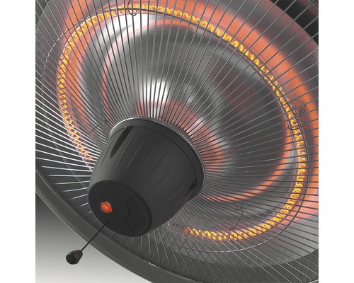 Detailansicht eines Heizstrahlers mit Schutzgitter und Zugschalter