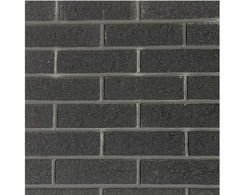 Gros plan d''un mur en pavés sombres.