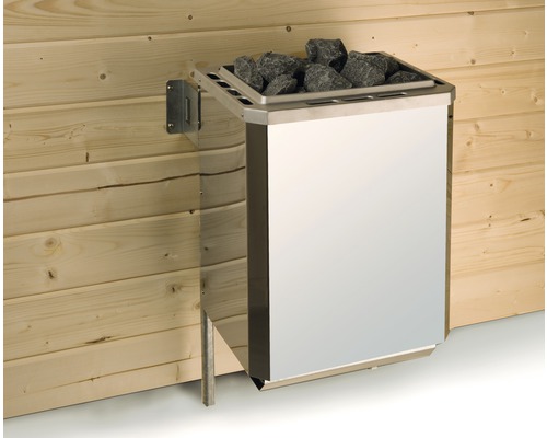 Poêle de sauna en métal avec pierres sur mur en bois