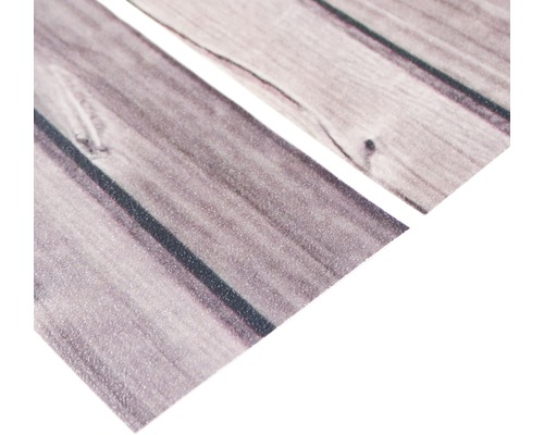 Gros plan d''un film autocollant pour meubles avec une structure en bois