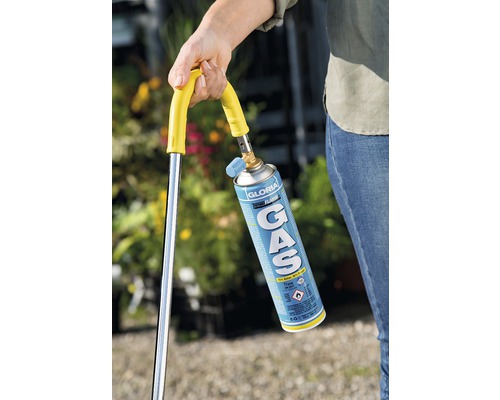 Brûleur de mauvaises herbes avec cartouche de gaz à la main