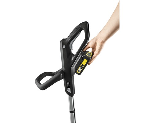 Vue d''ensemble d''un coupe-bordures à batterie avec batterie insérée.