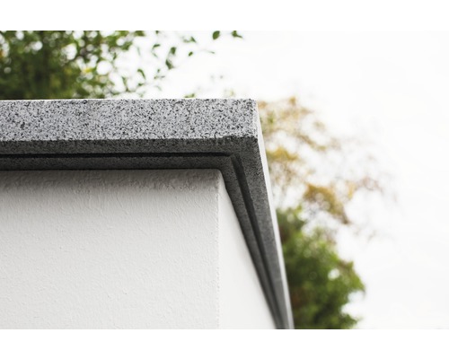 Gros plan d''un couvre-mur en granit sur un mur.