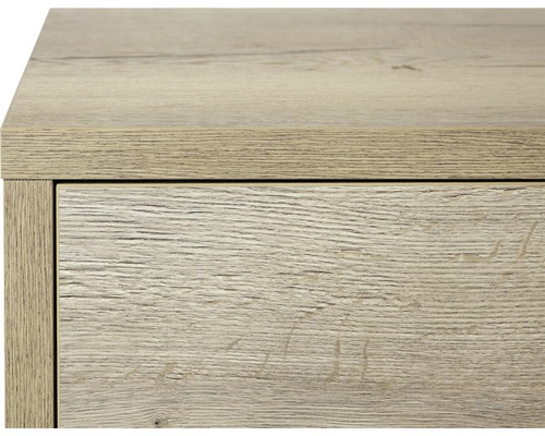 Detailaufnahme eines Schranks mit Schublade in Holzoptik