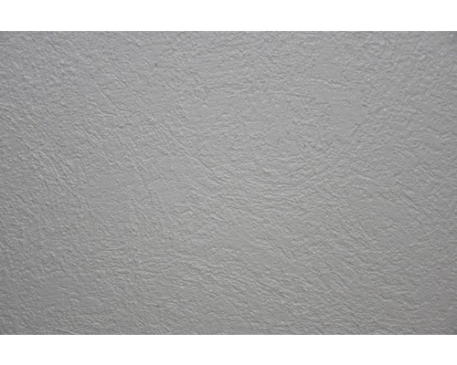 Gros plan d''une surface d''enduit