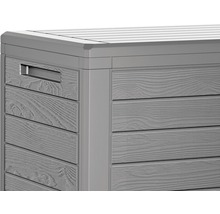 Detailansicht einer grauen Aufbewahrungsbox mit Holzoptik und Griff