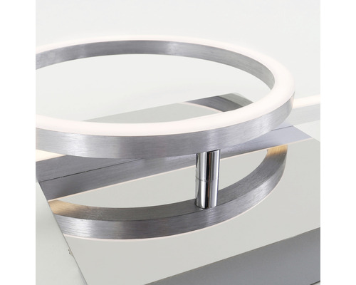 Gros plan d''un plafonnier LED moderne avec un design en forme d''anneau et un boîtier en métal