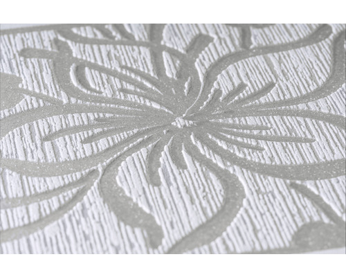 Gros plan d''un papier peint avec un motif floral et une texture en relief