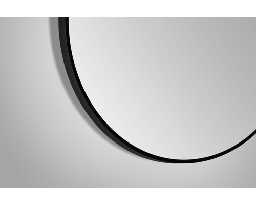 Vue détaillée d''un miroir rond avec un cadre noir