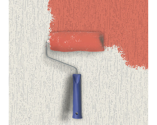 De la peinture est appliquée sur un mur avec un rouleau à peinture