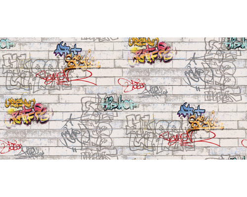 Papier peint avec graffiti sur un mur de briques