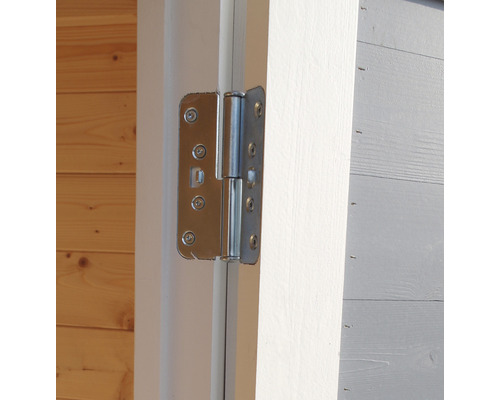 Gros plan d''une charnière de porte métallique sur une porte en bois