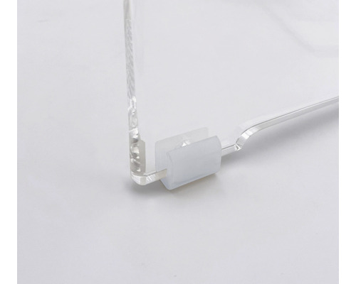 Vue détaillée d''une plaque en verre acrylique transparente avec élément de fixation