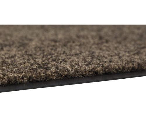 Vue détaillée d''un paillasson avec surface textile et bordure en caoutchouc