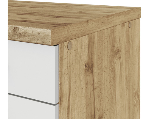 Gros plan d''une armoire avec motif bois et tiroirs blancs