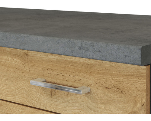 Gros plan d''un élément de tiroir avec un dessus aspect béton et une poignée en métal