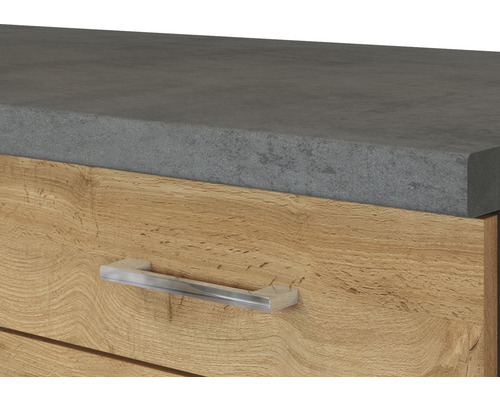 Gros plan d''un meuble avec une surface grise et un tiroir en bois avec une poignée