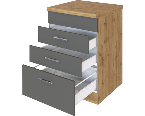 Commode avec trois tiroirs partiellement ouverts