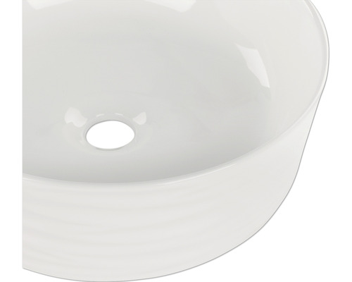 Aufsicht eines runden Keramikwaschbeckens mit Abfluss