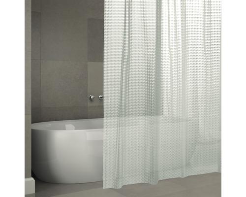 Badezimmer mit Badewanne und Duschvorhang