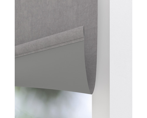 Graues Rollo zur Fensterdekoration und zum Sonnenschutz.