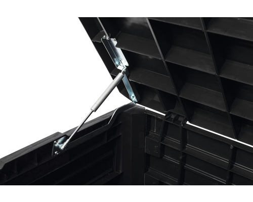 Vue détaillée d''un couvercle en plastique ouvert avec ressort à gaz