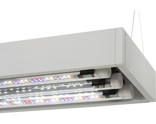 Gros plan d''une suspension blanche avec trois tubes LED