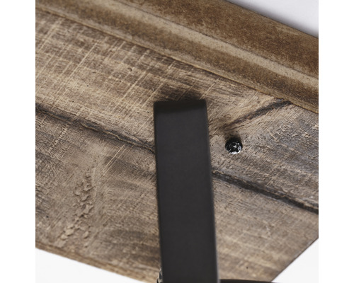 Vue détaillée d'un plateau de table en bois avec pied en métal