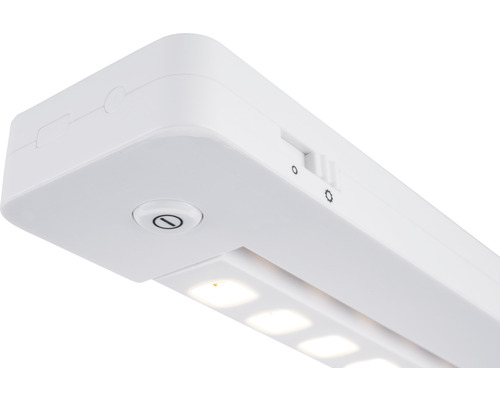 Luminaire LED blanc sous meuble avec interrupteur pour régler la luminosité.