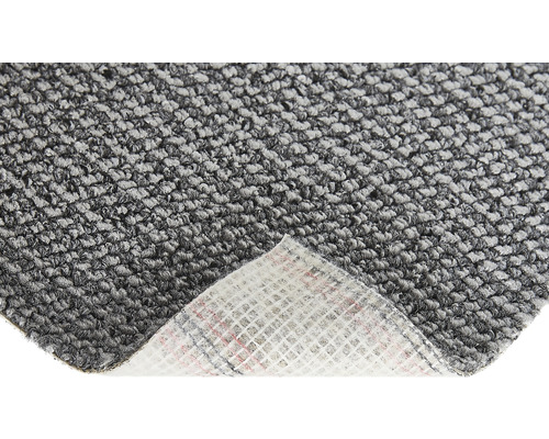 Nahaufnahme eines grauen Teppichs mit Textilrücken