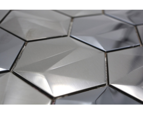 Gros plan de carreaux muraux hexagonaux à l''éclat métallique avec motif géométrique