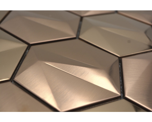 Gros plan de carreaux muraux hexagonaux avec un motif géométrique tridimensionnel.