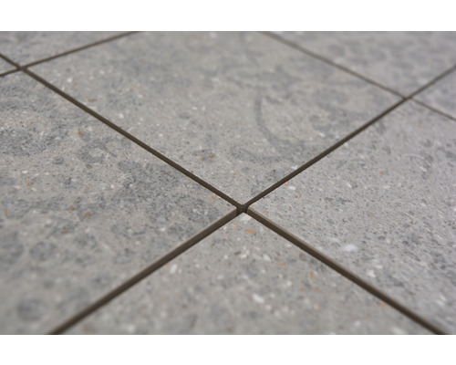 Gros plan de carreaux de sol avec une surface mouchetée