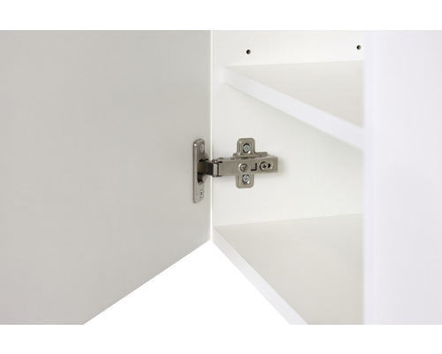 Charnière sur une porte d''armoire blanche