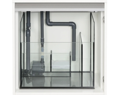 Vue intérieure d''un meuble d''aquarium avec technique de filtration et pompe.