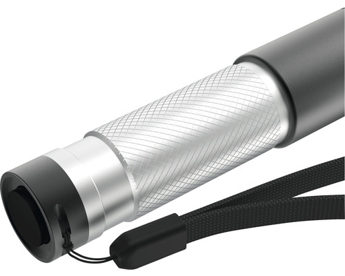 Gros plan d''une lampe de poche grise avec dragonne