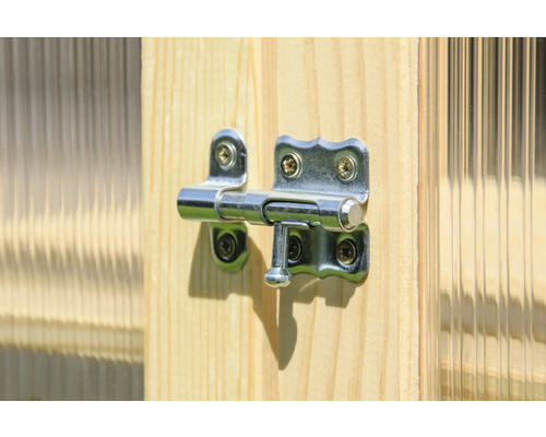Verrou de porte en métal fixé sur une porte en bois