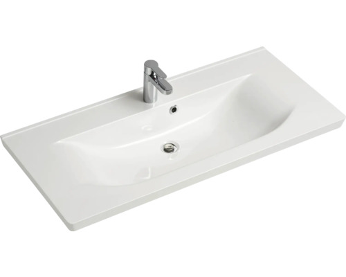 Waschtisch aus Sanitärkeramik mit Armatur