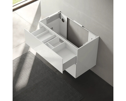 Meuble sous-lavabo blanc avec tiroirs ouverts et compartiments pour l''aménagement de la salle de bains