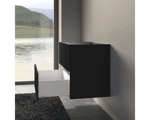 Meuble sous-lavabo noir avec tiroir ouvert dans la salle de bain