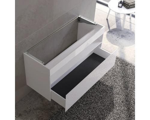 Meuble sous-lavabo blanc avec tiroir dans une salle de bain moderne.