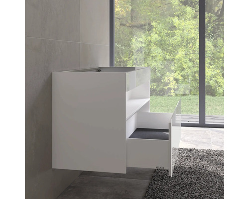 Meuble sous-lavabo blanc avec tiroir ouvert dans une salle de bains.